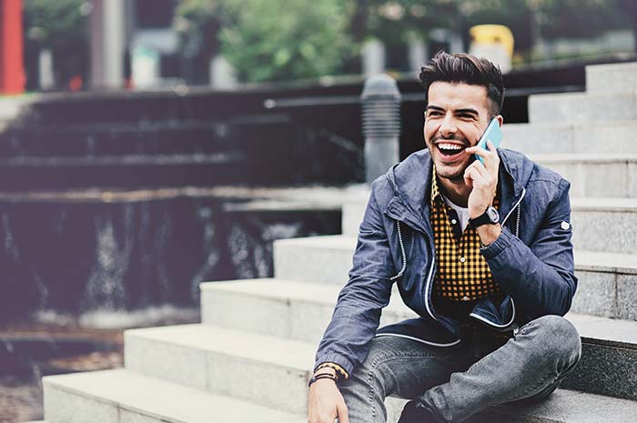 Person using phone for audio conferencing